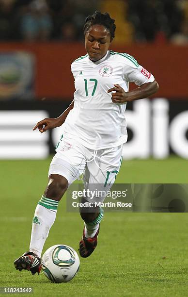 Francisca Ordega of Nigeria runs with the ball during the FIFA Women's World Cup 2011 Group A match between Canada and Nigeria at...