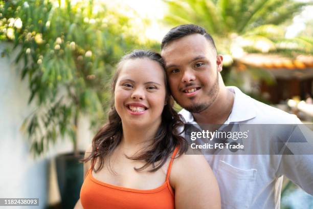 portrait of happy special needs couple looking at camera - good family couple stock pictures, royalty-free photos & images