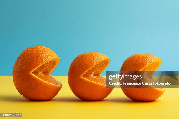 three oranges lined up - citrus fruit stock pictures, royalty-free photos & images