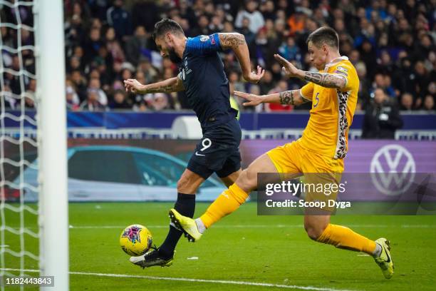 Olivier GIROUD of France and Veaceslav POSMAC of Moldavia during the Euro Cup Qualification - Group H match between France and Moldavie on November...