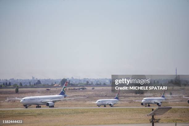 Aeroplanes are seen standing on the tarmac at the O.R. Tambo International Airport in Johannesburg, South Africa, on November 15, 2019. - The South...