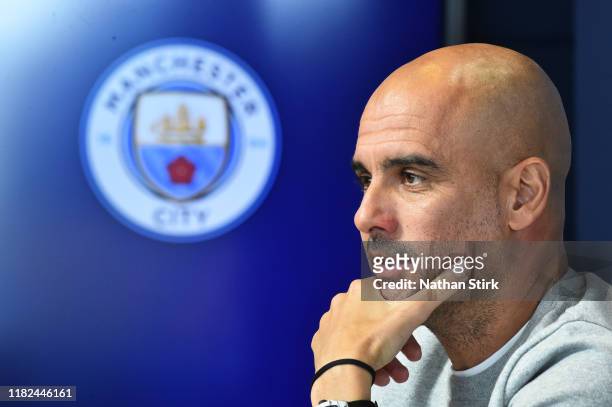 Pep Guardiola, Manager of Manchester City speaks with the media during a Press Conference at The Academy Stadium on October 21, 2019 in Manchester,...