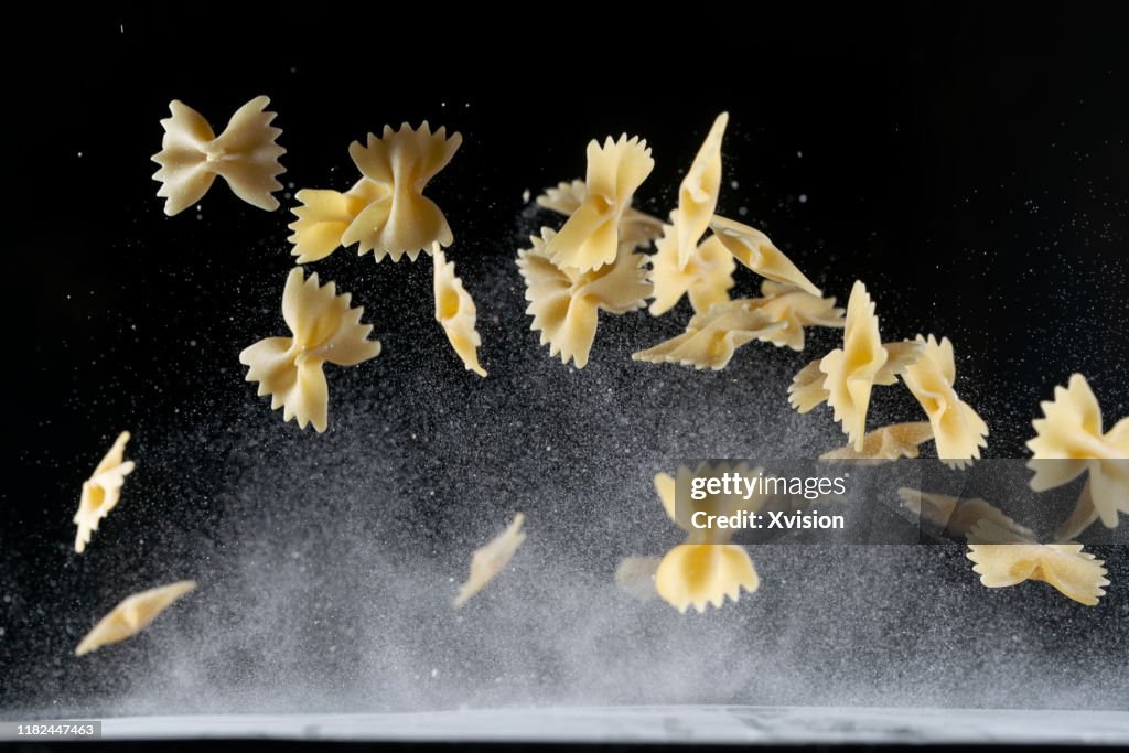 Farfalle pasta flying in mid air with high speed sync.