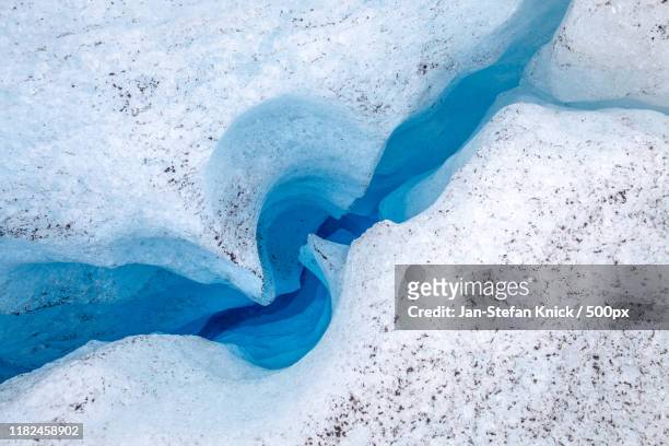 close-up of ice hole - jan stefan knick stockfoto's en -beelden
