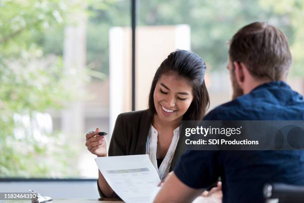 loan officer reviews loan with customer - credit union stock pictures, royalty-free photos & images