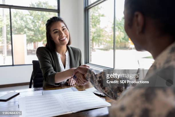 financial advisor meets with veteran - credit union stock pictures, royalty-free photos & images