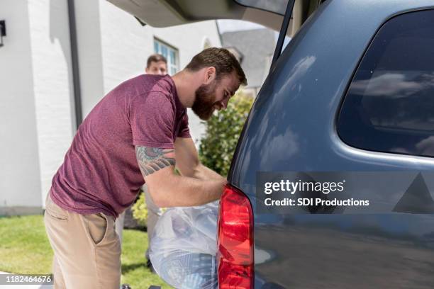 Loading Off Car 276 Unloading Suv Stock Photos, High-Res Pictures, and Images - Getty ...
