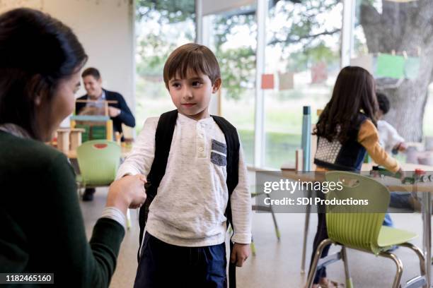 teacher greets young student - no confidence stock pictures, royalty-free photos & images