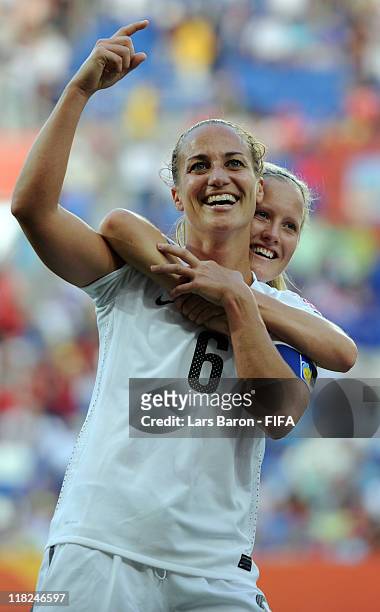Rebecca Smith of New Zealand, who scored his teams first goal, celebrates with team mate Katie Hoyle after the FIFA Women's World Cup 2011 Group B...