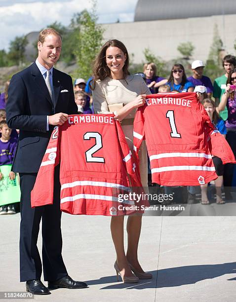 Catherine, the Duchess of Cambridge and Prince William, Duke of Cambridge are presented with hockey shirts as they visit the Somba K'e Civic Plaza on...