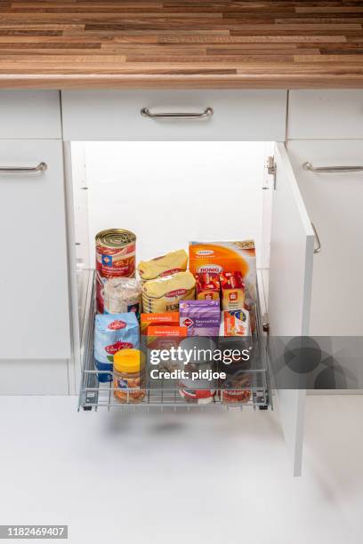 kitchen pantry shelve filled with groceries - food display cabinet stock pictures, royalty-free photos & images