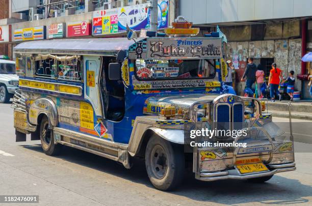 jeepneys in metro manila - philippines jeepney stock pictures, royalty-free photos & images