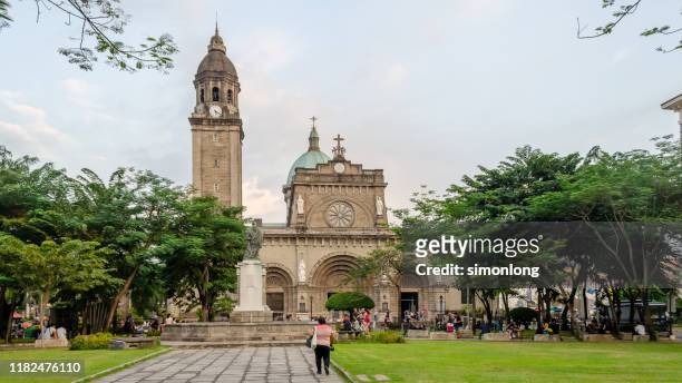 wide shot tourist visit cathedral intramuros manila, philippines - manila philippines stockfoto's en -beelden