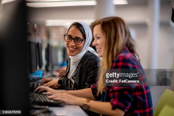 university students studying online stock photo - afghani stock pictures, royalty-free photos & images