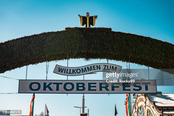 main entrance sign at munich's oktoberfest on a sunny morning in october - oktoberfest home stock pictures, royalty-free photos & images