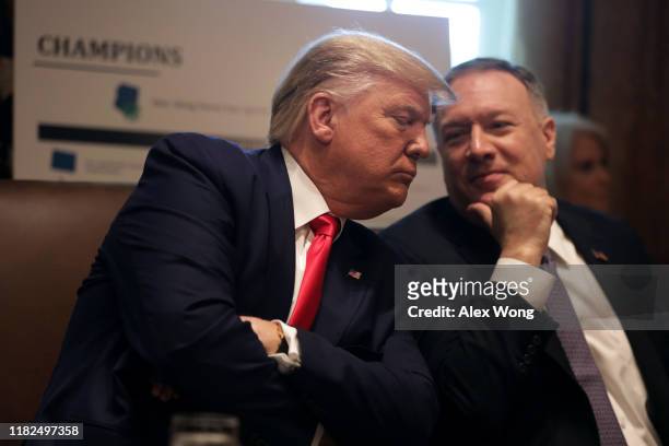 President Donald Trump listens to Secretary of State Mike Pompeo during a cabinet meeting at the Cabinet Room of the White House October 21, 2019 in...
