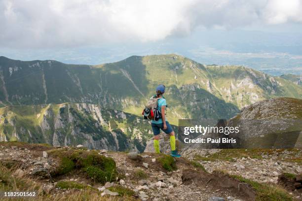 young woman hiker walking in bucegi mountains,carpathians,transylvania,romania - alps romania stock pictures, royalty-free photos & images