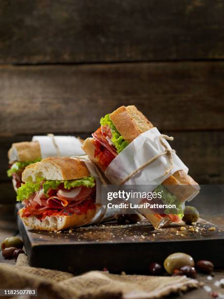 italian sandwich with roasted red peppers - submarine sandwich stock pictures, royalty-free photos & images