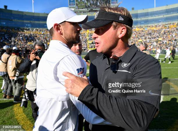 Head coach Jon Gruden of the Oakland Raiders and head coach Matt LaFleur of the Green Bay Packers shake hands after the game at Lambeau Field on...
