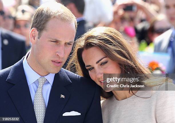 Prince William, Duke of Cambridge and Catherine, Duchess of Cambridge look on during an an official welcome ceremony at the Somba K'e Civic Plaza on...