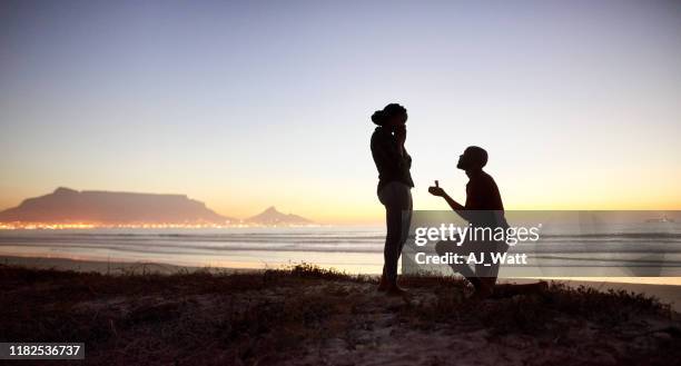 will you marry me? - man holding engagement ring stock pictures, royalty-free photos & images