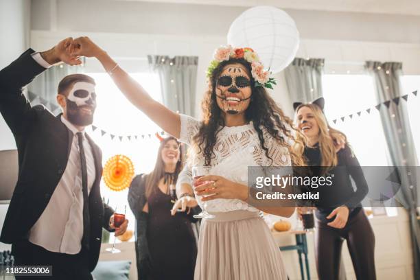halloween multi ethnic party - halloween stock pictures, royalty-free photos & images