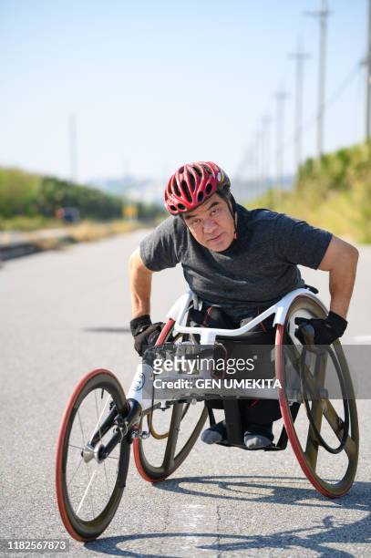 wheel chair racer - paraplegic race stock pictures, royalty-free photos & images