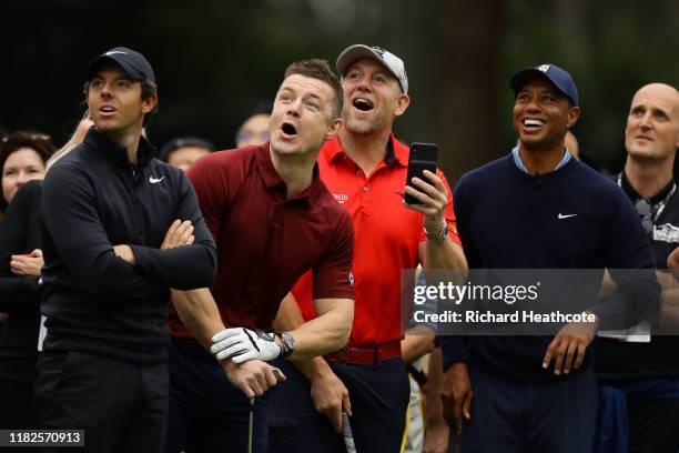Rory McIlroy of Northern Ireland, former rugby player Brian O'Driscoll of Ireland, former rugby player Mike Tindall of England and Tiger Woods of the...