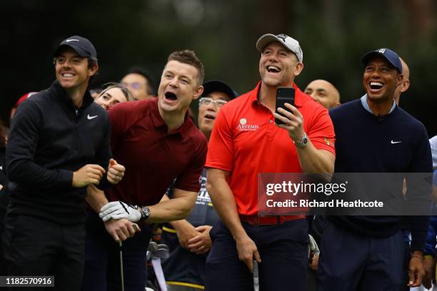 Rory McIlroy of Northern Ireland, former rugby player Brian O'Driscoll of Ireland, former rugby player Mike Tindall of England and Tiger Woods of the...