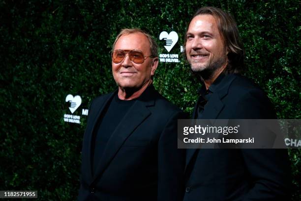 Michael Kors and Lance LePere attend God's Love We Deliver 13th Annual Golden Heart Awards celebration at Cipriani South Street on October 21, 2019...