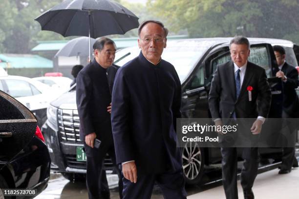 China's Vice President Wang Qishan arrives at the Imperial Palace to attend the proclamation ceremony of Japan's Emperor Naruhito on October 22, 2019...