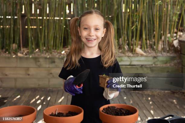 happy young girl gardening - watering can stock pictures, royalty-free photos & images