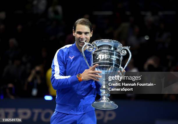 Rafael Nadal recieving his trophy after being announced as ATP Tour end of year world number one following his singles match against Stefanos...