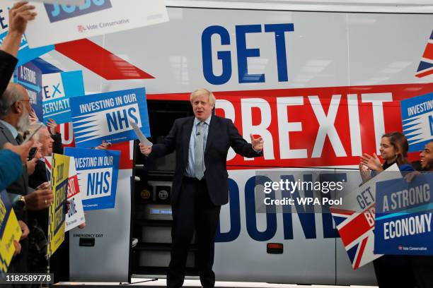 Prime Minister Boris Johnson addresses his supporters prior to boarding his General Election campaign trail bus on November 15, 2019 in Manchester,...