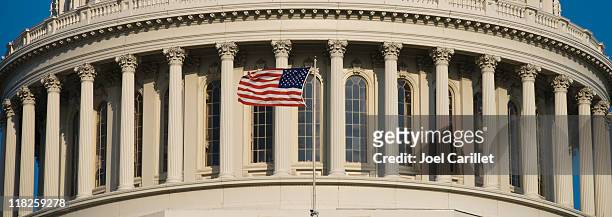 us flag at capitol - house of representatives stock pictures, royalty-free photos & images