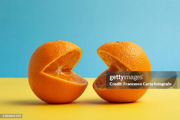 orange fruit - mund stock-fotos und bilder