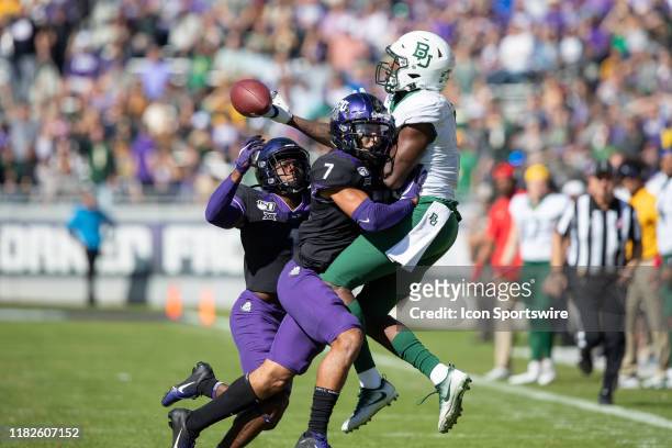 Baylor Bears wide receiver Denzel Mims tries to make a catch as TCU Horned Frogs safety Trevon Moehrig and TCU Horned Frogs cornerback Tre'vius...