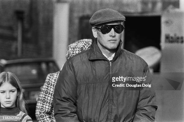 American actor, film director, producer, and race car driver Paul Newman , and, walking behind him, his daughter Melissa Newman, UK, 11th February...