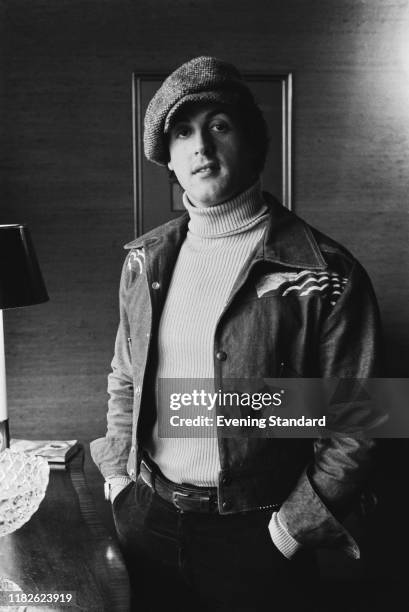 American actor, director, screenwriter, and producer Sylvester Stallone wearing baker boy hat, UK, 4th February 1977.