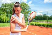 Pretty young girl injured during tennis practice