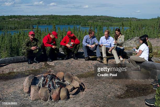 Prince William, Duke of Cambridge and Catherine, Duchess of Cambridge eat a lunch of Arctic Char with members of the Canadian Rangers and Canadian...