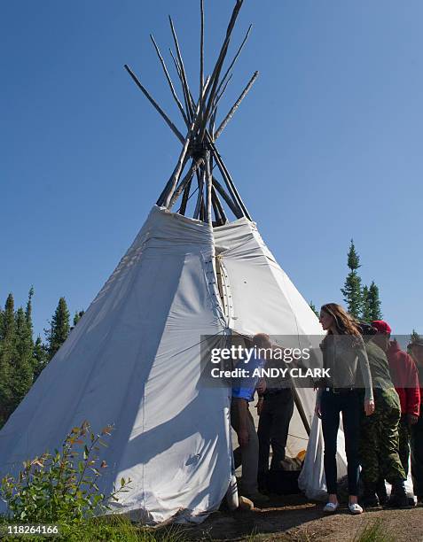 Britain's Prince William and his wife Catherine, Duchess of Cambridge eat a lunch of Arctic Char while Blatchford Lake, Northwest Territories July 5,...