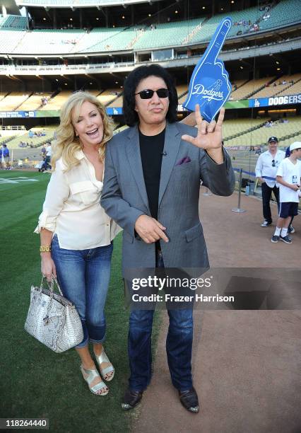 Musician Gene Simmons and Shannon Tweed attend the Dodgers v Mets game to throw out the first pitch of the game at Dodger Stadium on July 5, 2011 in...