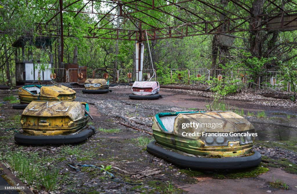 Rusty bumper cars in the abandoned amusement park of Pripyat Ghost City