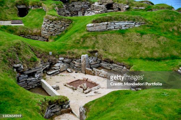 Skara Brae is a stone-built Neolithic settlement, located on the west coast of Mainland, the largest island in the Orkney archipelago of Scotland....