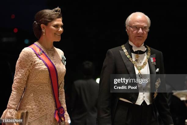 Crown Princess Victoria of Sweden and her father Carl XVI Gustaf of Sweden arrive at the Imperial Palace for the Court Banquets after the Ceremony of...