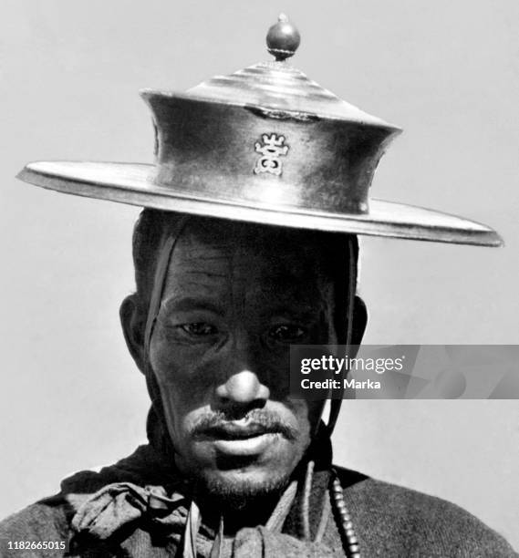 Lama with golden hat, italian expedition in tibet, 1920-30.