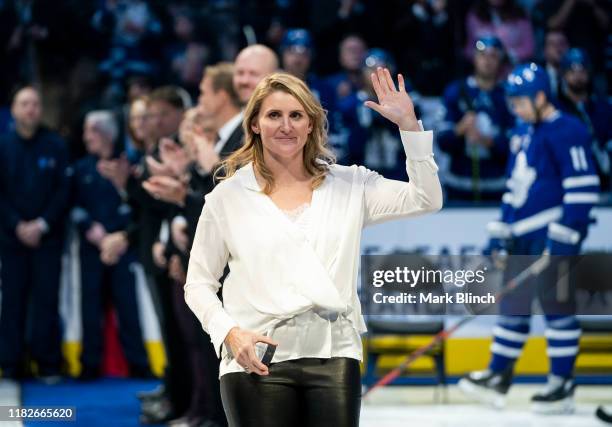 Hockey Hall of Fame inductee Hayley Wickenheiser waves to the crowd during a pre-game ceremony at the Scotiabank Arena on November 15, 2019 in...