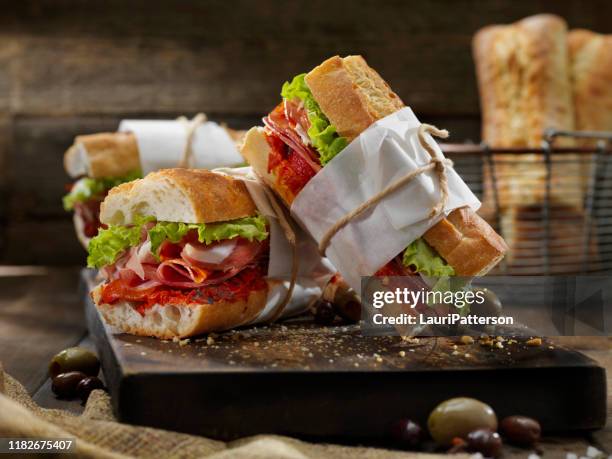 italian sandwich with roasted red peppers - prosciutto wrapped stock pictures, royalty-free photos & images