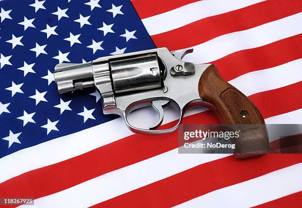 pistol on american flag - american flag gun stock pictures, royalty-free photos & images